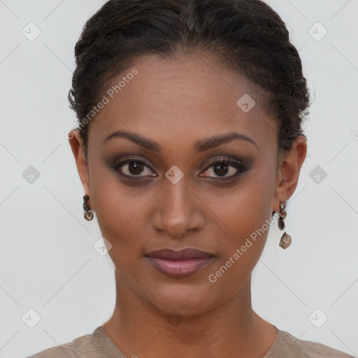 Joyful black young-adult female with short  brown hair and brown eyes
