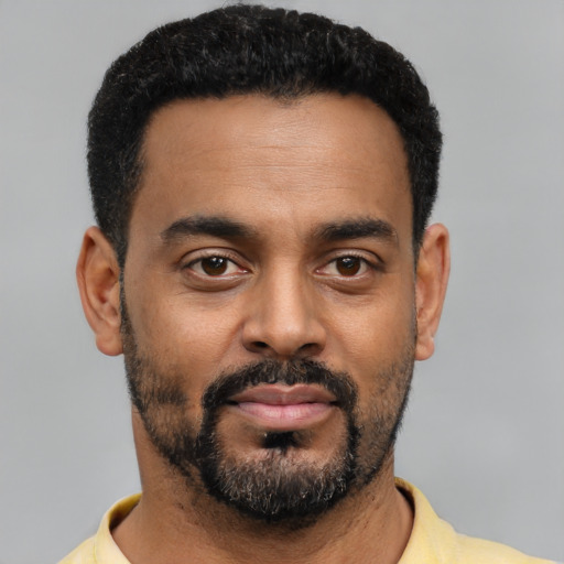 Neutral black young-adult male with short  black hair and brown eyes