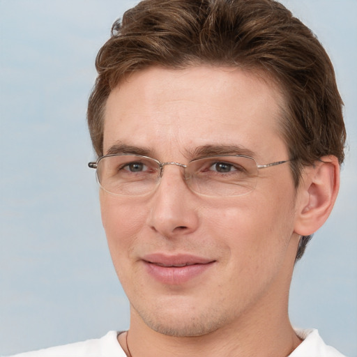 Joyful white adult male with short  brown hair and grey eyes