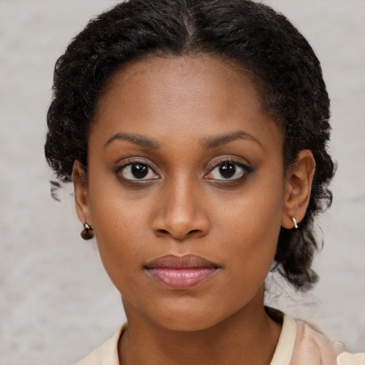 Neutral black young-adult female with short  brown hair and brown eyes
