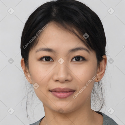 Joyful asian young-adult female with medium  black hair and brown eyes