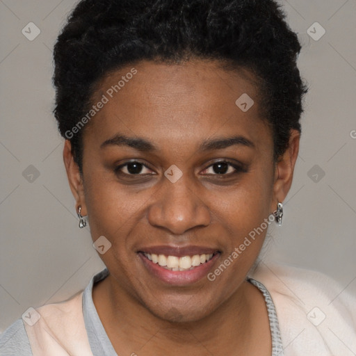 Joyful black young-adult female with short  brown hair and brown eyes