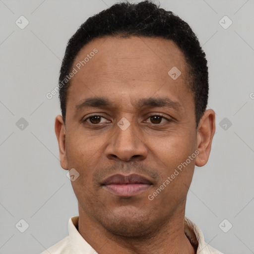 Neutral latino young-adult male with short  black hair and brown eyes