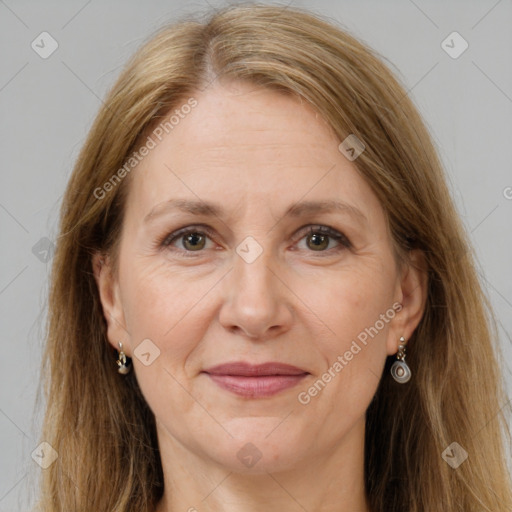 Joyful white adult female with long  brown hair and grey eyes