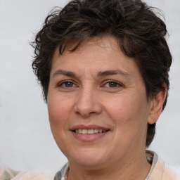 Joyful white adult female with short  brown hair and brown eyes