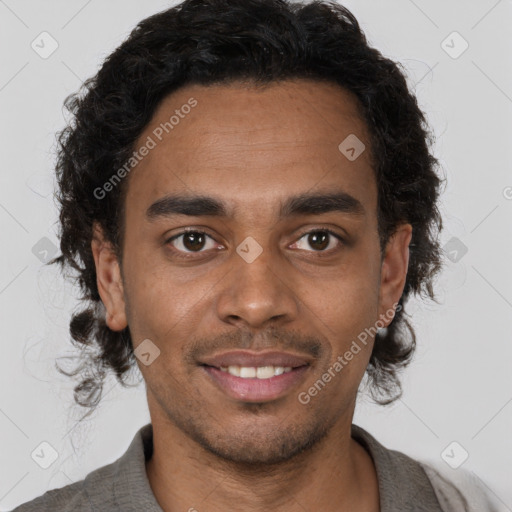 Joyful black young-adult male with short  brown hair and brown eyes