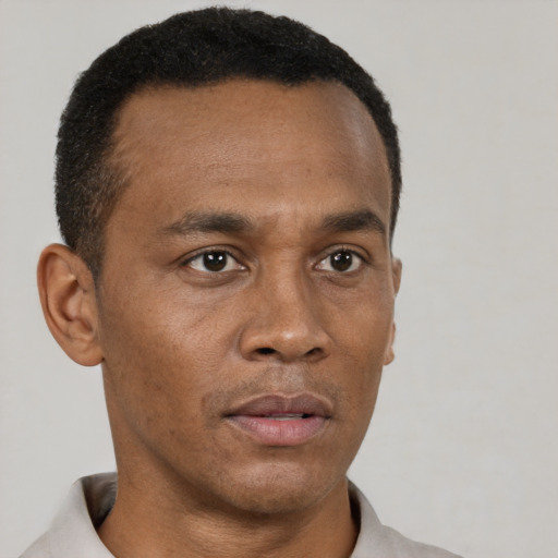 Neutral black adult male with short  black hair and brown eyes