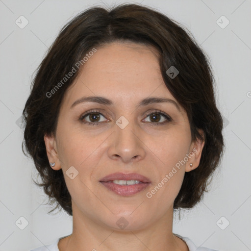 Joyful white adult female with medium  brown hair and brown eyes