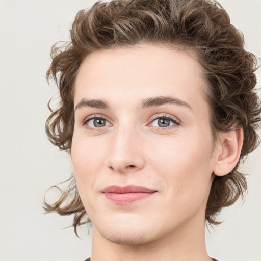 Joyful white young-adult female with medium  brown hair and green eyes