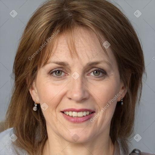 Joyful white adult female with medium  brown hair and grey eyes