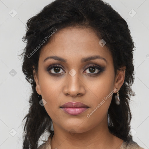 Joyful black young-adult female with long  brown hair and brown eyes