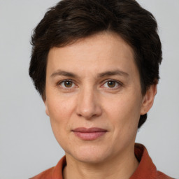 Joyful white adult female with short  brown hair and brown eyes