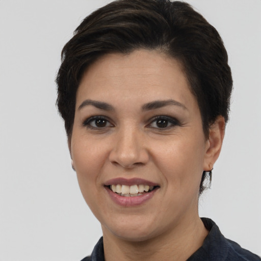 Joyful white young-adult female with short  black hair and brown eyes