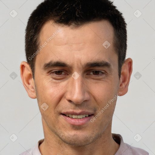 Joyful white adult male with short  brown hair and brown eyes