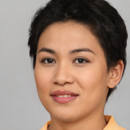 Joyful asian young-adult female with short  brown hair and brown eyes