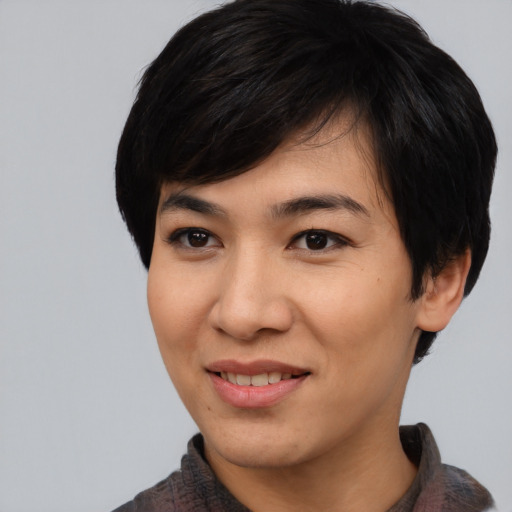 Joyful asian young-adult female with medium  black hair and brown eyes