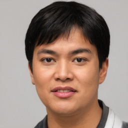 Joyful asian young-adult male with short  black hair and brown eyes