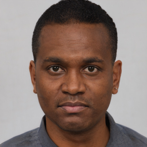 Neutral black young-adult male with short  black hair and brown eyes