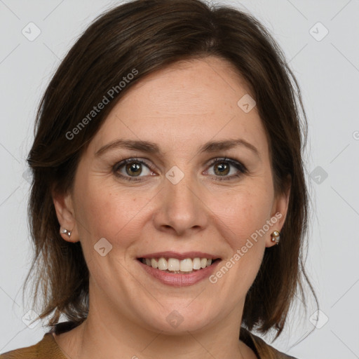 Joyful white adult female with medium  brown hair and grey eyes