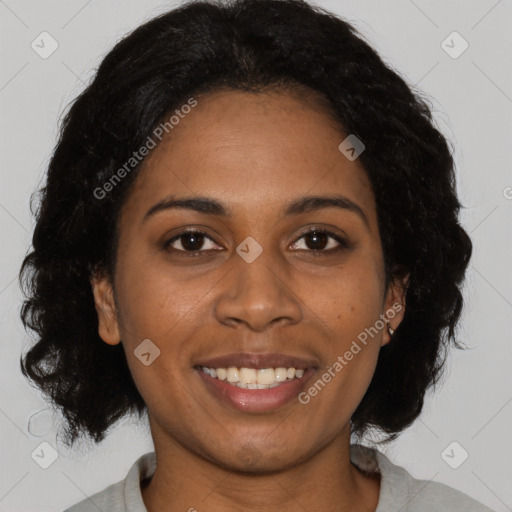 Joyful black young-adult female with medium  brown hair and brown eyes