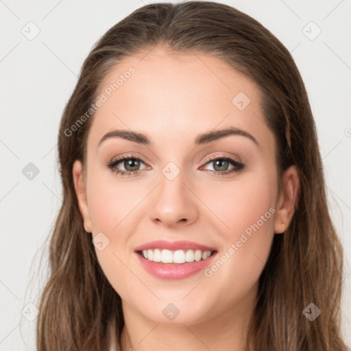 Joyful white young-adult female with long  brown hair and grey eyes