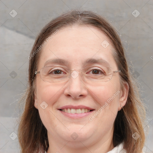 Joyful white adult female with medium  brown hair and brown eyes