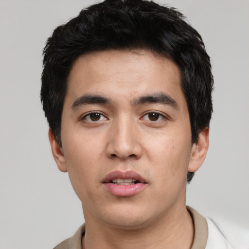 Neutral white young-adult male with short  black hair and brown eyes