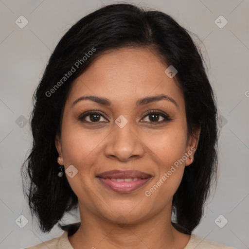 Joyful latino adult female with medium  brown hair and brown eyes