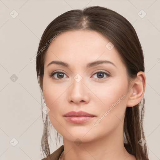 Neutral white young-adult female with long  brown hair and brown eyes