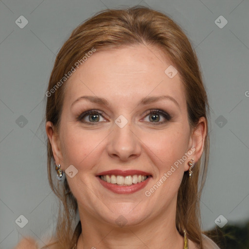 Joyful white adult female with medium  brown hair and blue eyes