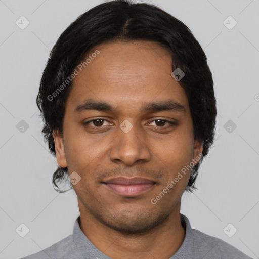 Joyful black young-adult male with short  black hair and brown eyes