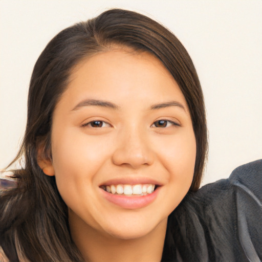 Joyful asian young-adult female with long  brown hair and brown eyes