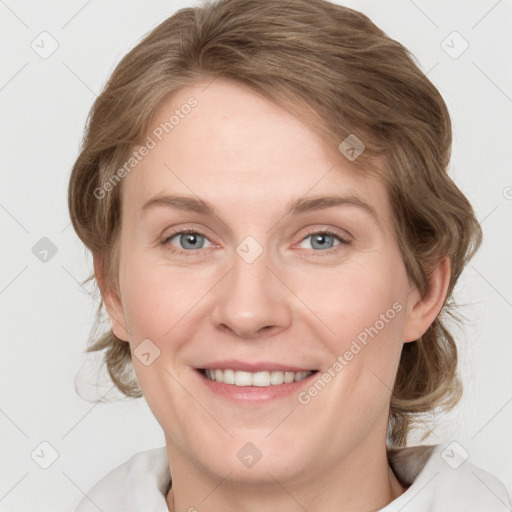 Joyful white young-adult female with medium  brown hair and blue eyes