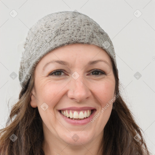 Joyful white young-adult female with long  brown hair and grey eyes