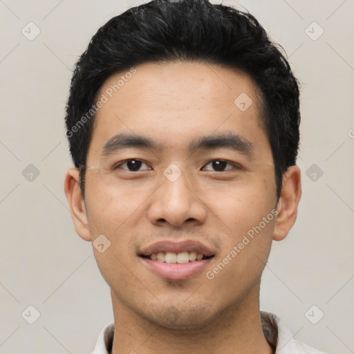 Joyful asian young-adult male with short  black hair and brown eyes