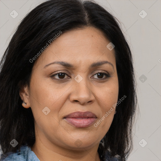 Joyful latino adult female with medium  brown hair and brown eyes
