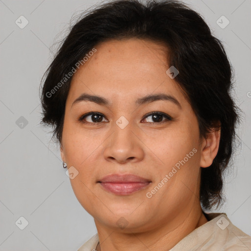 Joyful asian adult female with medium  brown hair and brown eyes