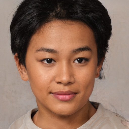 Joyful asian young-adult female with short  brown hair and brown eyes