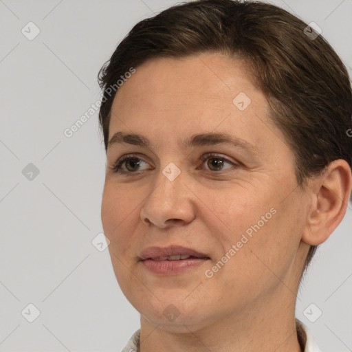 Joyful white adult female with short  brown hair and brown eyes