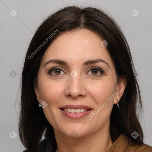 Joyful white adult female with medium  brown hair and brown eyes