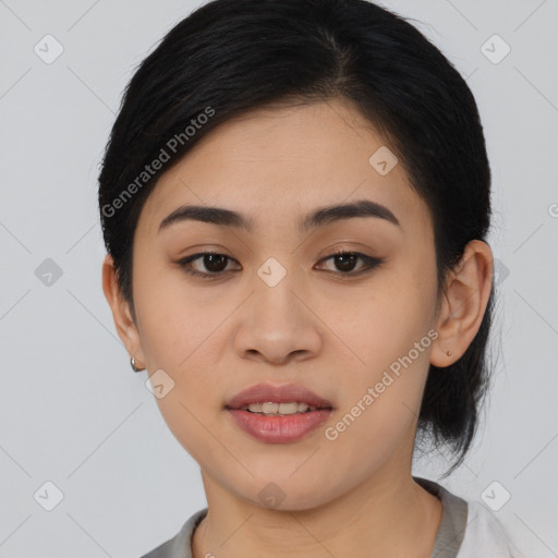 Joyful asian young-adult female with medium  black hair and brown eyes