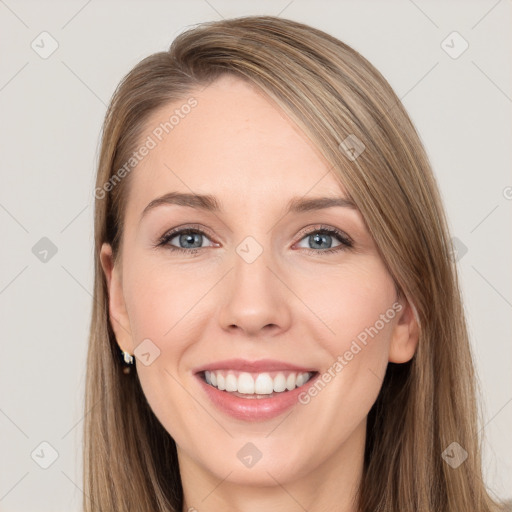 Joyful white young-adult female with long  brown hair and grey eyes