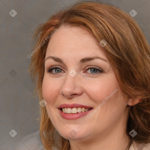 Joyful white adult female with long  brown hair and brown eyes