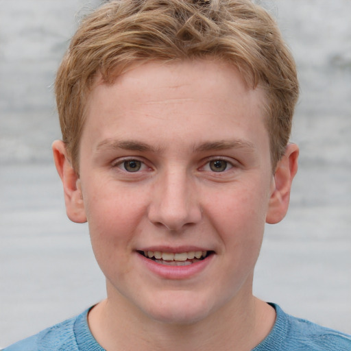 Joyful white young-adult male with short  brown hair and blue eyes