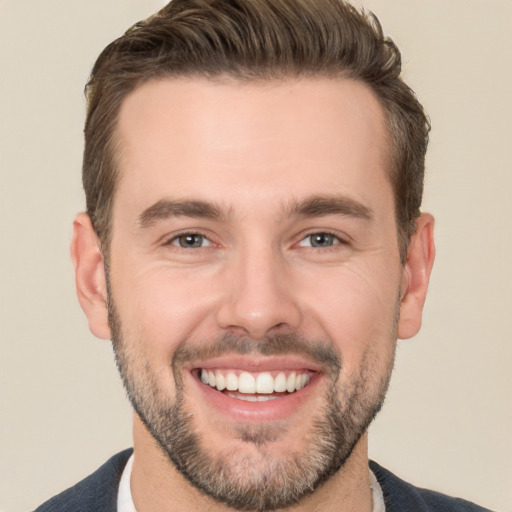 Joyful white young-adult male with short  brown hair and brown eyes