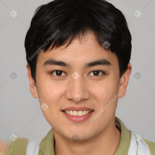 Joyful asian young-adult male with short  brown hair and brown eyes