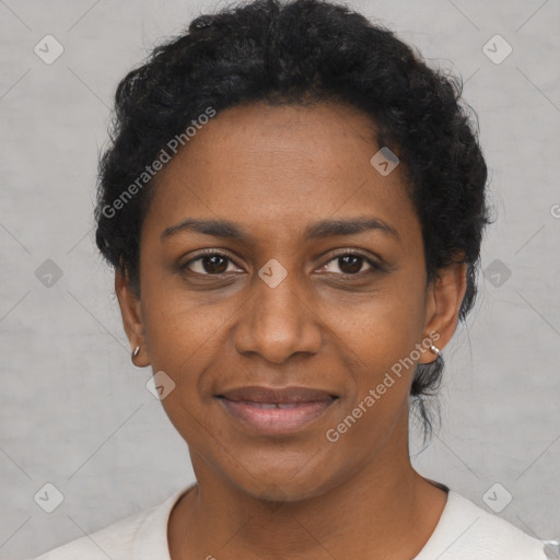 Joyful black adult female with short  black hair and brown eyes