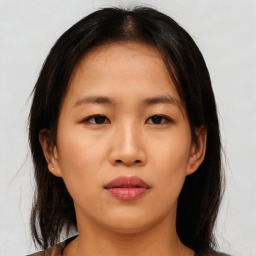 Neutral asian young-adult female with medium  brown hair and brown eyes