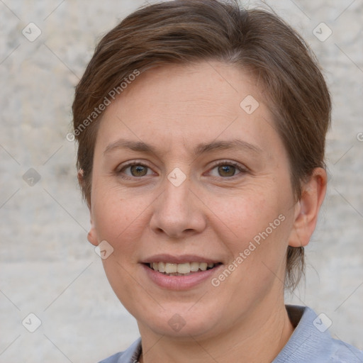 Joyful white adult female with short  brown hair and grey eyes