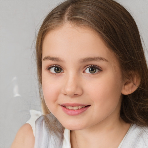 Joyful white child female with medium  brown hair and brown eyes